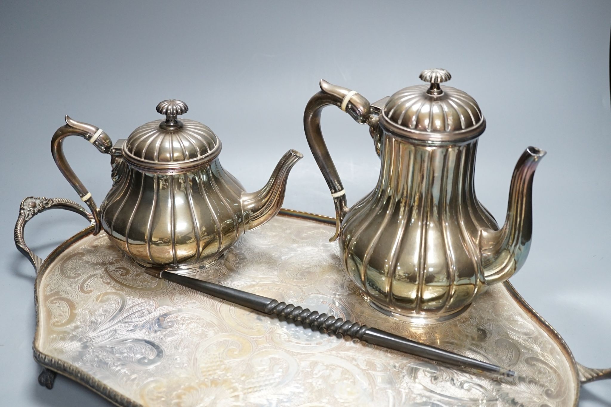 A four piece plated tea set and tray